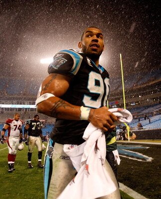 CHARLOTTE, NC - JANUARY 10:  Julius Peppers #89 of the Carolina Panthers walks off the field in the rain after being defeated by the Arizona Cardinals 33-13 in the NFC Divisional Playoff Game on January 10, 2009 at Bank of America Stadium in Charlotte, No