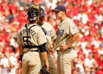 ST. LOUIS - OCTOBER 04:  Starting pitcher, Jake Peavy #44 of the San Diego Padres talks to pitching coach Darren Balsley and catcher, Ramon Hernandez #55 during Game One of the National League Divison Series against the St. Louis Cardinals at Busch Stadiu