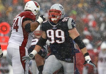 FOXBORO, MA - DECEMBER 21:  Mike Wright #99 of the New England Patriots reacts after a defensive play against the Arizona Cardinals at Gillette Stadium on December 21, 2008 in Foxboro, Massachusetts. The Patriots won 47-7. (Photo by Jim Rogash/Getty Image