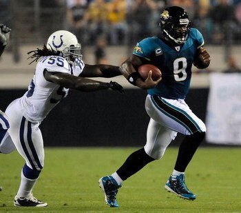 JACKSONVILLE, FL - DECEMBER 18:  David Garrard #9 of the Jacksonville Jaguars breaks the tackle of Clint Session #55 of the Indinapolis Colts during the game at Jacksonville Municipal Stadium on December 18, 2008 in Jacksonville, Florida.  (Photo by Sam G