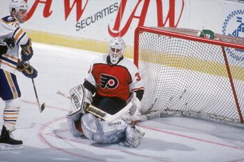 BUFFALO, NY - 1990:  Goalie Pete Peeters #33 of the Philadelphia Flyers keeys his eyes on the action as he protects the net during a game against the Buffalo Sabres in the 1990-1991 NHL season at Buffalo Memorial Auditorium in Buffalo, New York.  (Photo b