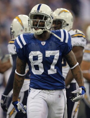 INDIANAPOLIS - JANUARY 13:  Reggie Wayne #87 of the Indianapolis Colts reacts after he made a reception for a first down on a 4th and 2 play in the first quarter against the San Diego Chargers during their AFC Divisional Playoff game at the RCA Dome on Ja