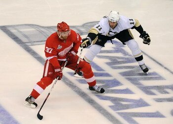 DETROIT - JUNE 12:  Mikael Samuelsson #37 of the Detroit Red Wings controls the puck near the blueline against Jordan Staal #11 of the Pittsburgh Penguins during Game Seven of the 2009 NHL Stanley Cup Finals at Joe Louis Arena on June 12, 2009 in Detroit,