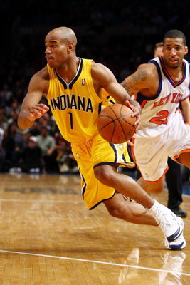 NEW YORK - FEBRUARY 23: Jarrett Jack #1 of the Indiana Pacers drives to the basket past Wilson Chandler #21 of the New York Knicks during the game at Madison Square Garden February 23, 2009 in New York City. The Knicks won 123-119. NOTE TO USER: User e