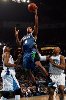 NEW ORLEANS - FEBRUARY 08: Ryan Gomes #8 of the Minnesota Timberwolves makes a shot over James Posey #41 and David West #30 of the New Orleans Hornets on February 8, 2009 in New Orleans, Louisiana. NOTE TO USER: User expressly acknowledges and agrees t