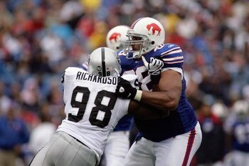 ORCHARD PARK, NY - SEPTEMBER 21:  Langston Walker #68 of the Buffalo Bills blocks Jay Richardson #98 of the Oakland Raiders during the game on September 21, 2008 at Ralph Wilson Stadium in Orchard Park, New York. (Photo by Rick Stewart/Getty Images)