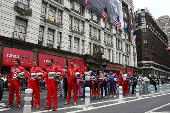 NEW YORK - MAY 18:  Dario Franchitti (L) driver of the #10 Target Chip Ganassi Racing Dallara Honda, Ryan Briscoe (C) driver of the #6 Team Penske Dallara Honda and Helio Castroneves, (R) driver of the #3 Team Penske Dallara Honda stand in the front row a