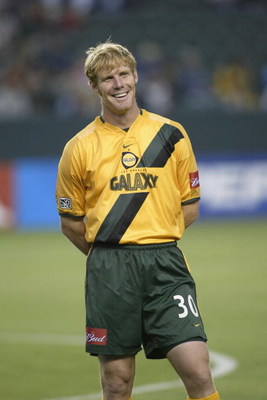 CARSON, CA - JUNE 18:  Defender Alexi Lalas #30 of the Los Angeles Galaxy smiles during player introductions before the Major League Soccer (MLS) game against the San Jose Earthquakes at the Home Depot Center on June 18, 2003 in Carson, California.  The g