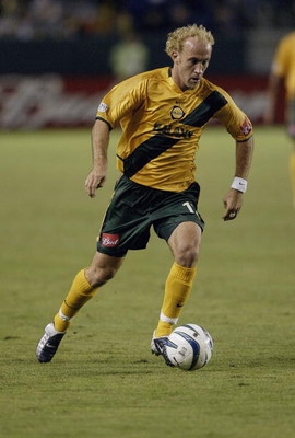 CARSON, CA - NOVEMBER 1:   Simon Elliott #12 of the Los Angeles Galaxy dribbles against the San Jose Earthquakes during the first round of the MLS Playoffs on November 1, 2003 in Torrance, California.  The Galaxy defeated the Earthquakes 2-0.  (Photo by D