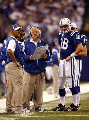 INDIANAPOLIS - NOVEMBER 16:  Payton Manning #18 of the Indianapolis Colts talks over a play with Head Coach Tony Dungy and Offensive Coordinator Tom Moore during the second quarter against the Houston Texans at Lucas Oil Stadium on November 16, 2008 in In