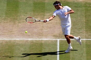 WIMBLEDON, ENGLAND - JULY 03:  Roger Federer of Switzerland plays a forehand during the men's singles semi final match against Tommy Haas of Germany on Day Eleven of the Wimbledon Lawn Tennis Championships at the All England Lawn Tennis and Croquet Club o