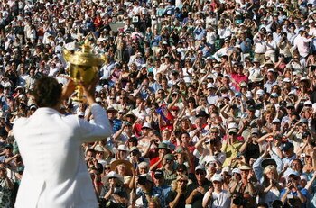 LONDON - JULY 08:  Roger Federer of Switzerland lifts the trophy as he celebrates victory following the Men's Singles final match against Rafael Nadal of Spain during day thirteen of the Wimbledon Lawn Tennis Championships at the All England Lawn Tennis a