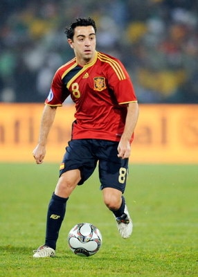 BLOEMFONTEIN, SOUTH AFRICA - JUNE 20:  Xavi Hernandez of Spain runs with the ball during the FIFA Confederations Cup match between Spain and South Africa at the Free State stadium on June 20, 2009 in Bloemfontein, South Africa.  (Photo by Kevork Djansezia