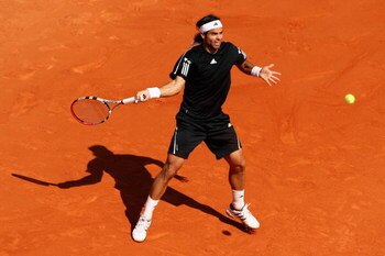 PARIS - JUNE 05:  Fernando Gonzalez of Chile hits a forehand during the Men's Singles Semi Final match against Robin Soderling of Sweden on day thirteen of the French Open at Roland Garros on June 5, 2009 in Paris, France.  (Photo by Clive Brunskill/Getty