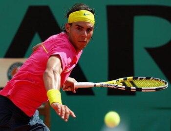 PARIS - MAY 31:  Rafael Nadal of Spain hits a forehand during the Men's Singles Fourth Round match against Robin Soderling of Sweden on day eight of the French Open at Roland Garros on May 31, 2009 in Paris, France.  (Photo by Clive Brunskill/Getty Images