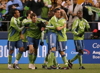 SEATTLE - MARCH 28:  Nate Jaqua #21 of the Seattle Sounders FC celebrates with the team after scoring a goal in the first half during the match against Real Salt Lake on March 28, 2009 at Qwest Field in Seattle, Washington. (Photo by Otto Greule Jr/Getty 