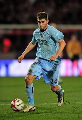 AALBORG, DENMARK - MARCH 19:  Ched Evans of Manchester City runs with the ball during the UEFA Cup, Round of 16, Second Leg match between Aalborg and Manchester City on March 19, 2009 in Aalborg, Denmark.  (Photo by Stuart Franklin/Getty Images)