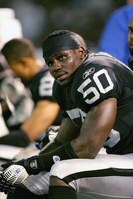 OAKLAND, CA - SEPTEMBER 11: Offensive Line back Isaiah Ekejiuba #50 of the Oakland Raiders sits in the sidelines during a game against the San Diego Chargers at McAfee Coliseum on September 11, 2006 in Oakland, California. (Photo by Jed Jacobsohn/Getty Im