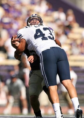SEATTLE - SEPTEMBER 6:  David Nixon #43 of the BYU Cougars puts a hit on a Washington Huskies player during their game on September 6, 2008 at Husky Stadium in Seattle, Washington. The Cougars defeated the Huskies 28-27. (Photo by Otto Greule Jr/Getty Ima