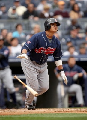 NEW YORK - APRIL 19:  Shin-soo Choo #17 of the Cleveland Indians hits a home run in the second inning of their game against the New York Yankees at Yankee Stadium on April 19, 2009 in the Bronx borough of New York City.  (Photo by Ezra Shaw/Getty Images)