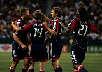 CARSON, CA - JULY 04:  Adam Cristman #7, Steve Ralston #14, Chris Albright #3 and Shalrie Joseph #21 of the New England Revolution celebrate Cristman's second of two goals in the first half against the Los Angeles Galaxy during their MLS match at the Home