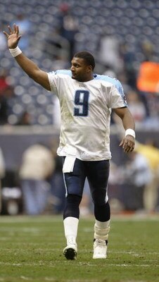 HOUSTON - DECEMBER 21:  Quarterback Steve McNair #9 of the Tennessee Titans waives as he walks off the field during the game against the Houston Texans on December 21, 2003 at Reliant Stadium in Houston, Texas.  The Titans won 27-24.   (Photo by Brian Bah