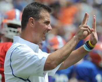 GAINESVILLE, FL - APRIL 18: Coach Urban Meyer of the University of Florida directs the spring football Orange and Blue game April 18, 2009 at Ben Hill Griffin Stadium in Gainesville, Florida.  (Photo by Al Messerschmidt/Getty Images)
