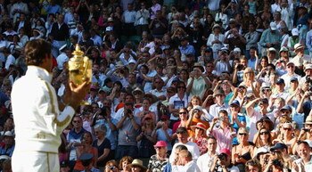 WIMBLEDON, ENGLAND - JULY 05:  Roger Federer of Switzerland celebrates victory with the trophy after the men's singles final match against Andy Roddick of USA on Day Thirteen of the Wimbledon Lawn Tennis Championships at the All England Lawn Tennis and Cr