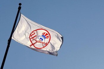 NEW YORK - APRIL 16: A Yankee flag waves over the new stadium during opening day between the New York Yankees and the Cleveland Indians at the new Yankee Stadium on April 16, 2009 in the Bronx borough of New York City. This is the first regular season MLB