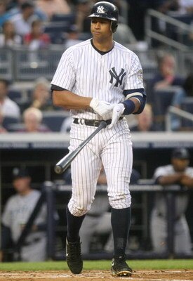NEW YORK - JULY 2:  Alex Rodriguez #13 of the New York Yankees tosses his bat after being walked in the bottom of the second inning against the Seattle Mariners at Yankee Stadium on July 2, 2009 in the Bronx borough of New York City.  (Photo by Nick Laham