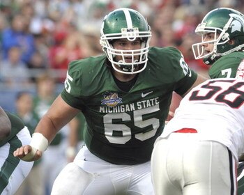 ORLANDO, FL - JANUARY 1: Center Joel Nitchman #65 of the Michigan State Spartans sets to block against the Georgia Bulldogs at the 2009 Capital One Bowl at the Citrus Bowl on January 1, 2009 in Orlando, Florida.  (Photo by Al Messerschmidt/Getty Images) 