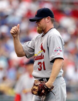 KANSAS CITY, MO - JUNE 20:  Pitcher Ryan Franklin #31 of the St. Louis Cardinals gives a thumbs up to catcher Yadier Molina #4 during the game against the Kansas City Royals on June 20, 2009 at Kauffman Stadium in Kansas City, Missouri.  (Photo by Jamie S