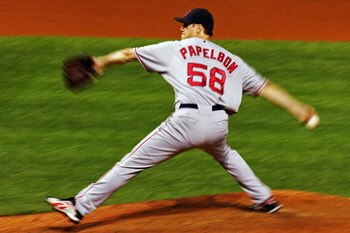 CLEVELAND - OCTOBER 18:  Closing pitcherJonathan Papelbon #58 of the Boston Red Sox delivers against the Cleveland Indians during Game Five of the American League Championship Series at Jacobs Field on October 18, 2007 in Cleveland, Ohio.  The Red Sox won