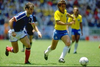 21 Jun 1986:  Zico (right) of Brazil takes on Batiston of France during the World Cup quarter-final at the Jalisco Stadium in Guadalajara, Mexico. France won 4-3 on penalties. \ Mandatory Credit: David  Cannon/Allsport