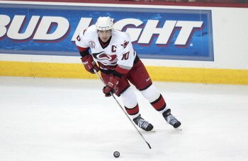 RALEIGH, NC - JUNE 10:  Center Ron Francis #10 of the Carolina Hurricanes skates with the puck against the Detroit Red Wings during game four of the NHL Stanley Cup Finals on June 10, 2002 at Entertainment Sports Arena in Raleigh, North Carolina.  The Red