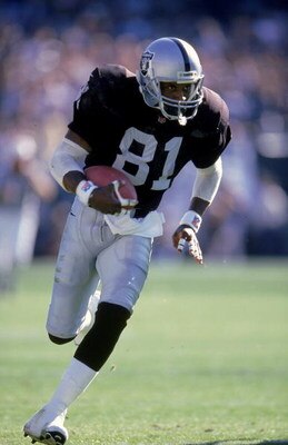 31 Oct 1999: Tim Brown #81 of the Oakland Raiders carries the ball during a game against the Miami Dolphins  at the Network Coliseum in Oakland, California. The Raiders defeated the Dolphins 9-6. Mandatory Credit: Otto Greule Jr.  /Allsport
