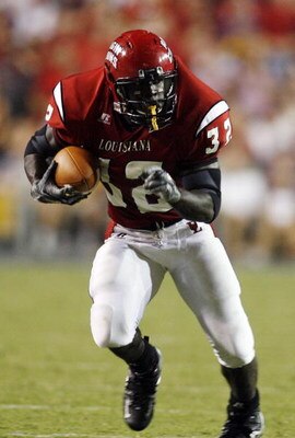 BATON ROUGE, LA - SEPTEMBER 02:  Tyrell Fenroy #32 of the University of Louisiana Lafayette runs against  Louisiana State University on September 2, 2006 at Tiger Stadium in Baton Rouge, Louisiana.  LSU defeated ULL 45-3.   (Photo by Chris Graythen/Getty 