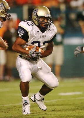 MIAMI - AUGUST 28:  Running back Sam Baptiste #33 of the Charleston Southern Buccaneers looks for room to run while taking on the Miami Hurricanes at Dolphin Stadium on August 28, 2008 in Miami, Florida. Miami defeated Charleston Southern 52-7.  (Photo by