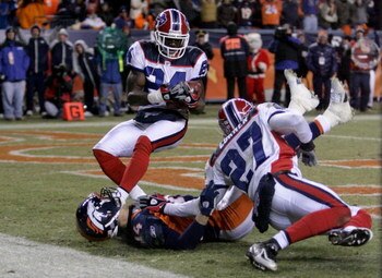 DENVER - DECEMBER 21:  Wide receiver Brandon Stokley #14 of the Denver Broncos was unable to make a reception on the Broncos final offensive play of the game as Reggie Corner #27 of the Buffalo Bills provided coverage on the play and Terrence McGee #24 co