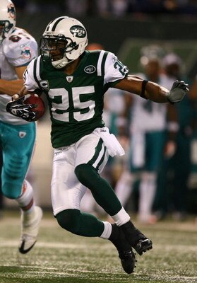 EAST RUTHERFORD, NJ - DECEMBER 28:  Kerry Rhodes #25 of The New York Jets intercepts the ball against The Miami Dolphins during their game on December 28, 2008 at Giants Stadium in East Rutherford, New Jersey.  (Photo by Al Bello/Getty Images)