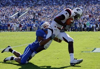 LEXINGTON, KY - OCTOBER 11:  Jason Barnes #4 of  the South Carolina Gamecocks catches a pass while defended by Robbie McAtee #36 of the Kentucky Widcats during the game at Commonwealth Stadium on October 11, 2008 in Lexington, Kentucky.  (Photo by Andy Ly