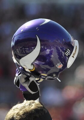 TAMPA, FL - NOVEMBER 16: Defensive end Jared Allen #69 of the Minnesota Vikings holds his helmet high and celebrates a score against the Tampa Bay Buccaneers at Raymond James Stadium on November 16, 2008 in Tampa, Florida.  (Photo by Al Messerschmidt/Gett