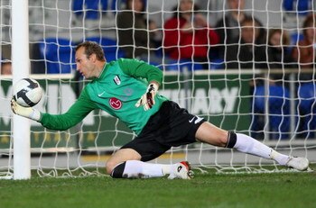GOLD COAST, AUSTRALIA - JULY 08:  Mark Schwarzer of Fulham saves a goal  during the exhibition football match between Gold Coast United and Fulham FC at Skilled Stadium on July 8, 2009 at the Gold Coast, Australia.  (Photo by Bradley Kanaris/Getty Images)
