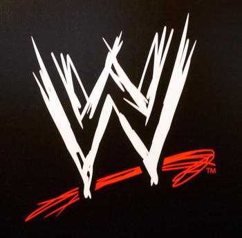 NEW YORK - MARCH 18:  The World Wrestling Entertainment logo hangs on a wall at a media conference announcing the all-star lineup of WWE WrestleMania XIX at ESPN Zone in Times Square March 18, 2003 in New York City.  (Photo by Mark Mainz/Getty Images)