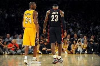 LOS ANGELES, CA - JANUARY 19:  Kobe Bryant #24 of the Los Angeles Lakers walks next to LeBron James #23 of the Cleveland Cavaliers during a break from the game at Staples Center on January 19, 2009 in Los Angeles, California.  (Photo by Harry How/Getty Im