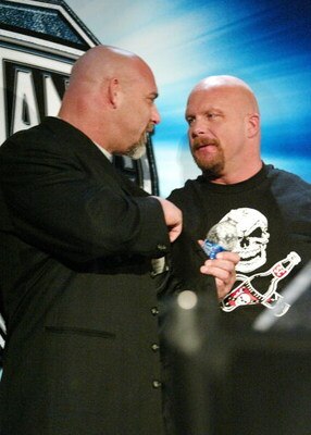NEW YORK - MARCH 11:  (L-R) Wrestlers Goldberg and Stone Cold Steve Austin attend a press conference to promote Wrestlemania XX at Planet Hollywood March 11, 2004 in New York City.  (Photo by Peter Kramer/Getty Images)