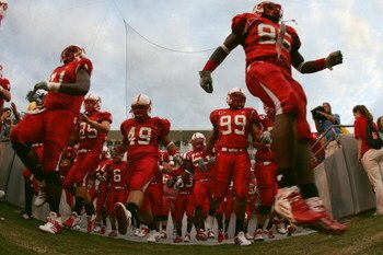 RALEIGH, NC - SEPTEMBER 4:  The North Carolina State University Wolfpack run onto the field for the game against the Virginia Polytechnic Institute and State University Hokies at Carter-Finley Stadium on September 4, 2005 in Raleigh, North Carolina.  Virg