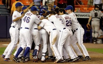 NEW YORK - JUNE 11:  The New York Mets mob teammate Carlos Beltran #15 after his walk-off two-run home run in the 13th inning against the Arizona Diamonbacks on June 11, 2008 at Shea Stadium in the Flushing neighborhood of the Queens borough of New York C