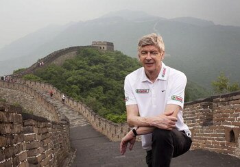BEIJING, CHINA - JUNE 7:  Arsenal Manager Arsene Wenger poses for a portrait on a visit to the Great Wall of China during his tour of Asia with FIFA World Cup sponsor Castrol, on June 7, 2008 in Beijing, China.  (Photo by Adam Pretty/Getty Images for Cast