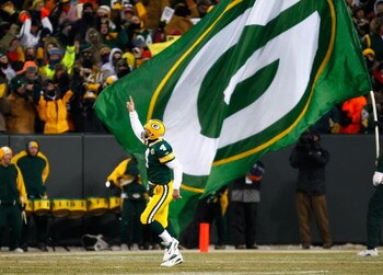 GREEN BAY, WI - JANUARY 20:  Quarterback Brett Favre #4 of the Green Bay Packers celebrates after throwing a 90 yard touchdown reception against the New York Giants during the NFC championship game on January 20, 2008 at Lambeau Field in Green Bay, Wiscon